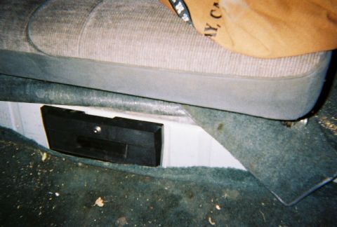 1991 Ford Bronco - Close-up of an interior car trim piece, possibly a storage compartment cover.