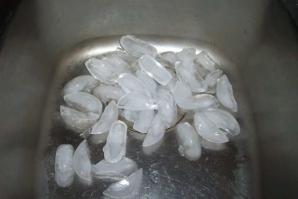 Ice cubes in a stainless steel sink