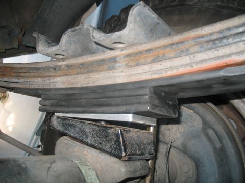 1992 Ford Bronco - although this looks kinda funny, the three cut up leafs only lift about 1". It is way better than the smaller aluminum lift block