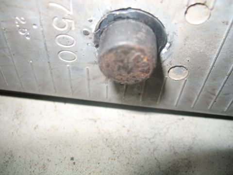 1992 Ford Bronco - close up of the leaf center bolt catching the pipe wedge