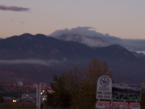 1972 Ford Ranchero - A sign for commercial property is visible in front of mountains at twilight.