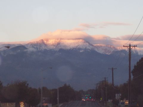 1972 Ford Ranchero - A scenic view of mountains dusted with snow under a colorful sunset sky.