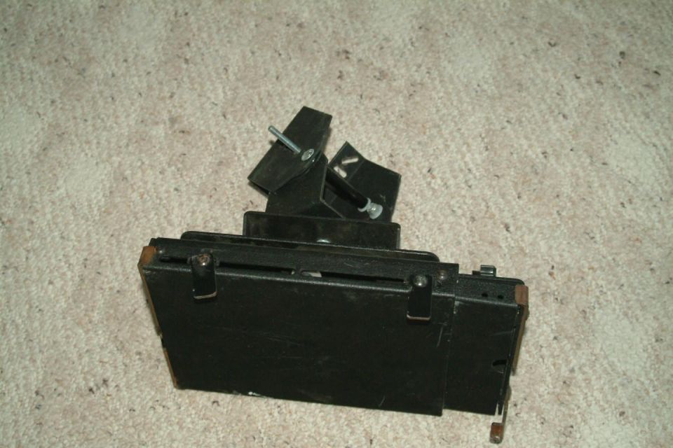 Black metal bracket assembly with adjustable arms and bolts