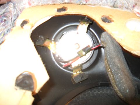 2002 Pontiac Trans Am - Close-up view of a car door speaker, showing its internal components and wiring connections.