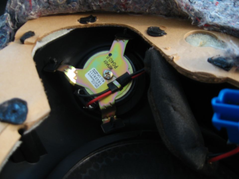 Car door speaker with part number REV01 P0405 and other markings