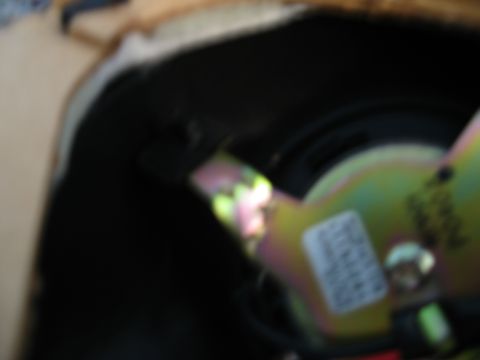 2002 Pontiac Trans Am - Close-up of a car speaker component, showing a metal bracket with a label.