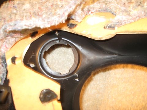 2002 Pontiac Trans Am - Interior trim panel with a circular opening, likely for a speaker or control.