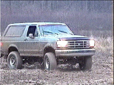 1993 Ford Bronco - Playing in a muddy field during the rain