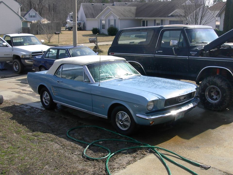 Blue 1965 Ford Mustang convertible parked in driveway