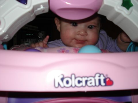 2000 Ford Crown Victoria - Baby in a Kolcraft walker with toys and a stereo in the background.