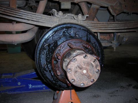 1995 Ford F-250 - Close-up of a vehicle's rear drum brake assembly, showing the hub and brake shoes.