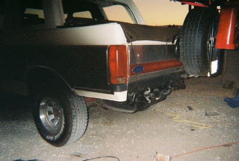 1991 Ford Bronco - Rear view of a 1991 Ford Bronco, its external spare tire and distinctive two-tone paint.