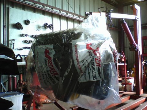 1984 Ford Bronco - Engine covered in plastic wrap with Jasper Engines & Transmissions branding.