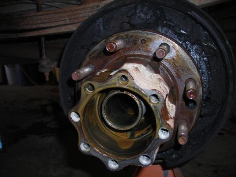 1995 Ford F-250 - A close-up view of a vehicle's wheel hub and brake drum assembly, showing signs of wear and tear.