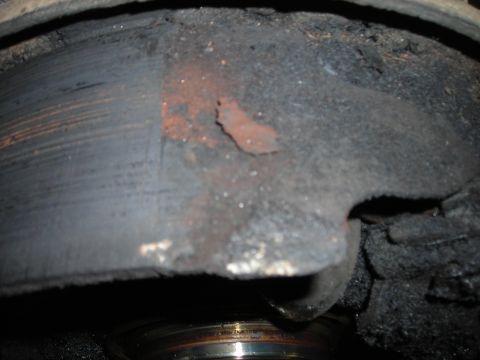 1995 Ford F-250 - Worn brake rotor and caliper assembly showing significant corrosion and wear.