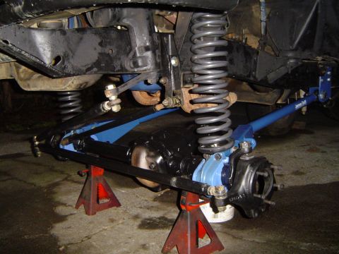 1978 Ford Bronco - Close-up of a vehicle's front suspension system, showing modified components.