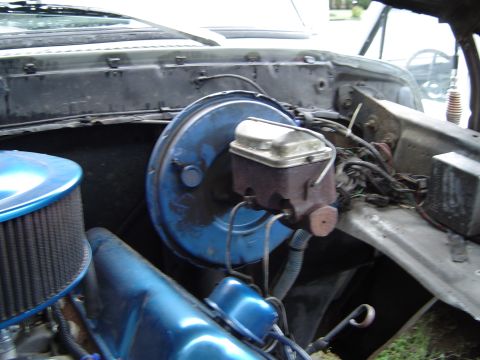 1978 Ford Bronco - Close-up view of the engine bay, focusing on the brake booster and master cylinder assembly.