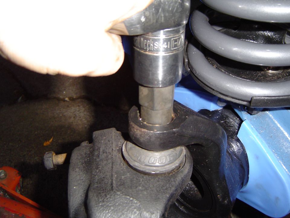 After torquing the lower balljoint you torque the adapter down on top