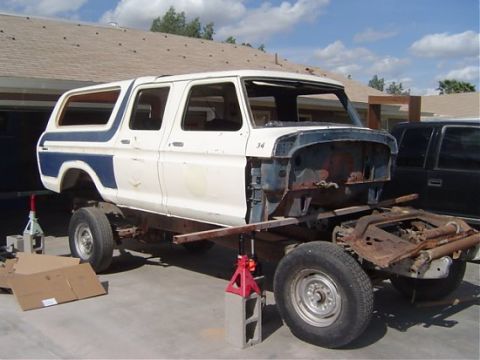1993 Ford C-350 (Centurion Conversions) - This Ford F-Series truck body is undergoing work, with its front end disassembled and chassis exposed.