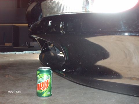1995 Ford Probe - Car bumper and headlight detail with a soda can for scale, dated 06/24/2005.