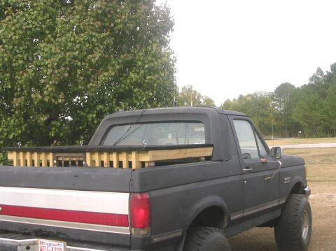 1989 Ford Bronco - Cab closed in and painted flat black Wooden thing is a dog box (kennel) for transporting dogs