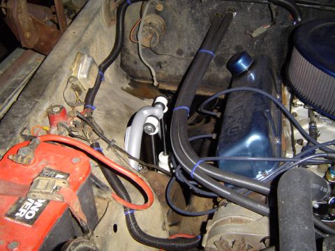 1978 Ford Bronco - Close-up view of engine bay components including a battery and AC evaporator.