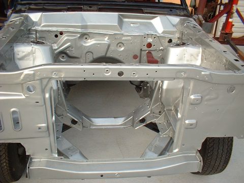 1967 Mercury Cyclone - The bare engine bay frame of a vehicle, showing structural components and suspension mounts.