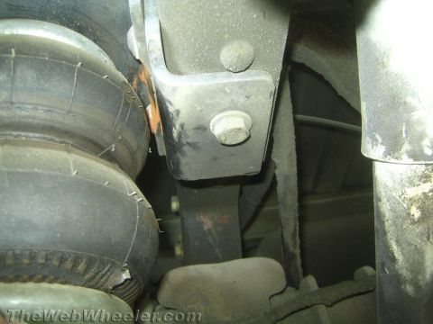 1994 Chevrolet Silverado 3500 - Underside view of a vehicle's suspension system, focusing on an air bag and mounting bracket.