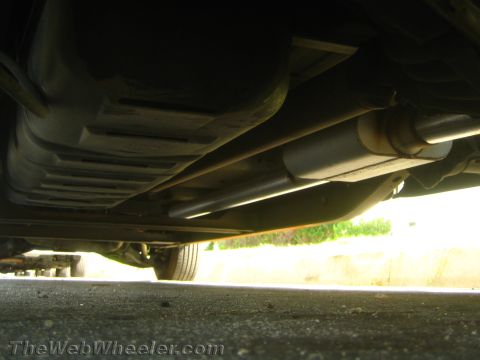 1994 Chevrolet Silverado 3500 - Underside view of a vehicle's fuel tank and exhaust system.