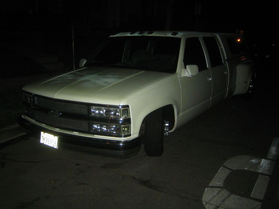 White crew cab dually pickup truck, looks like a 1995 model