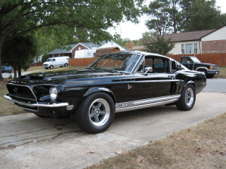 1968 Shelby GT500 - 1968 Shelby GT500 in black with classic racing stripes and wheels.