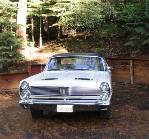 1972 Ford Ranchero - A 1966 Mercury Comet Cyclone is seen from the front, a distinctive grille and hood scoops.
