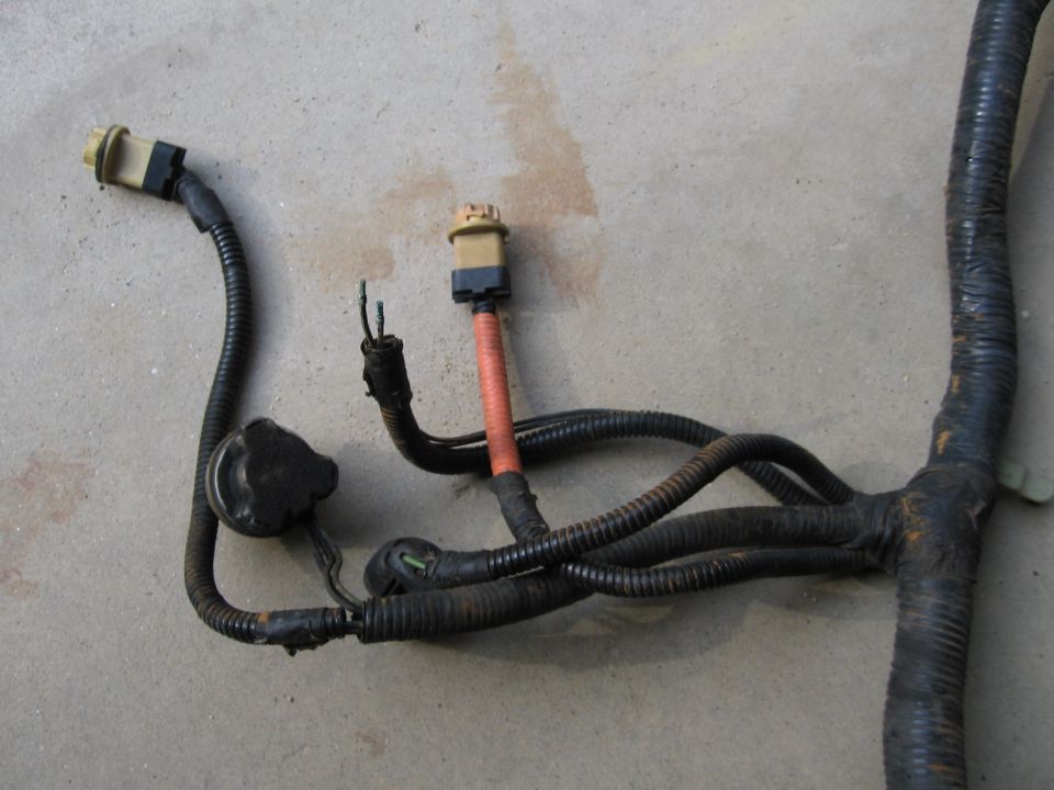 Another shot of the missing windshield washer pump plug with the driver's side light sockets.