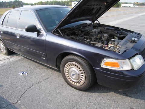 1991 Ford LTD Crown Victoria - 1991 Ford Crown Victoria LTD, hood open, parked outdoors on asphalt lot.