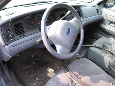 1991 Ford LTD Crown Victoria - The interior of a 1991 Ford Crown Victoria LTD is visible, including the dashboard and steering wheel.