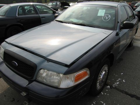 1991 Ford LTD Crown Victoria - Front view of a 1991 Ford Crown Victoria LTD, with another similar vehicle visible to the left.