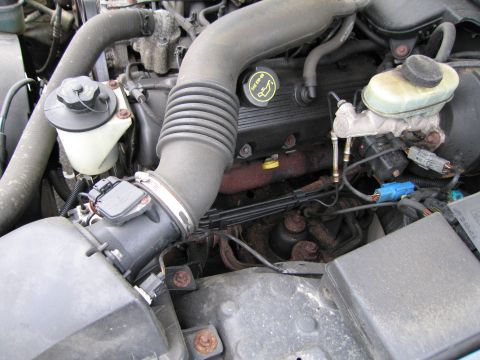 1991 Ford LTD Crown Victoria - Close-up view of a vehicle's engine bay, showing various components and wiring.