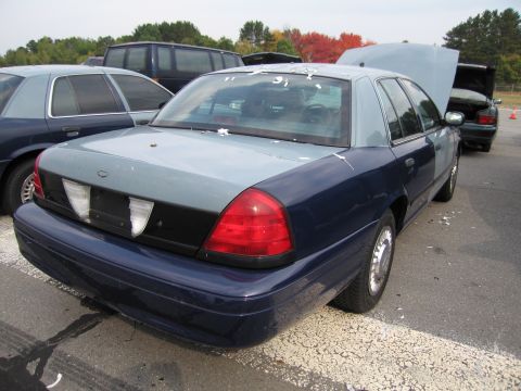 1991 Ford LTD Crown Victoria - This Ford Crown Victoria has a two-tone paint job and appears to be in a state of disrepair or modification.