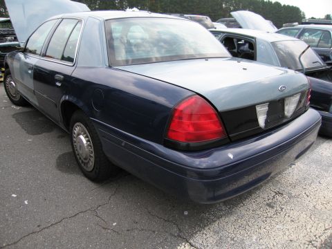 1991 Ford LTD Crown Victoria - This Ford Crown Victoria appears to be a later model, likely from the 2000s, with a two-tone paint job.