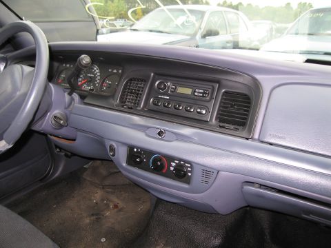 1991 Ford LTD Crown Victoria - The interior dashboard of a 1991 Ford Crown Victoria LTD shows the radio, climate controls, and steering wheel.