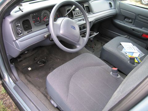 1991 Ford LTD Crown Victoria - Interior view of a 1991 Ford Crown Victoria LTD, showing the dashboard, steering wheel, and front seats.