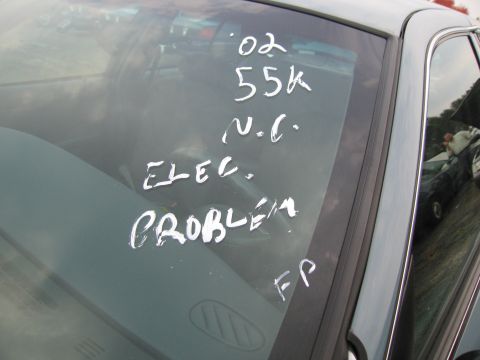 1991 Ford LTD Crown Victoria - Handwritten notes on a car windshield detail mileage and electrical issues.