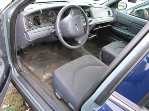 1991 Ford LTD Crown Victoria - Interior view of a 1991 Ford Crown Victoria LTD, showing the dashboard, steering wheel, and seats.