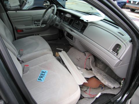 1991 Ford LTD Crown Victoria - Interior view of a 1991 Ford Crown Victoria LTD, including seats, dashboard, and a 'Free Car Care Club' sticker.