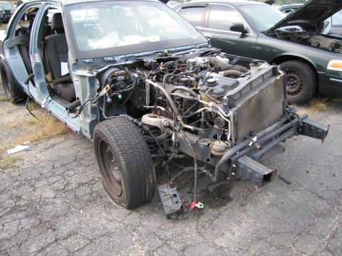 1991 Ford LTD Crown Victoria - This 1991 Ford Crown Victoria LTD is missing body panels and its engine is exposed.