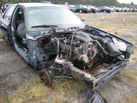 1991 Ford LTD Crown Victoria - This 1991 Ford Crown Victoria LTD is missing its front end, revealing the engine and chassis components.
