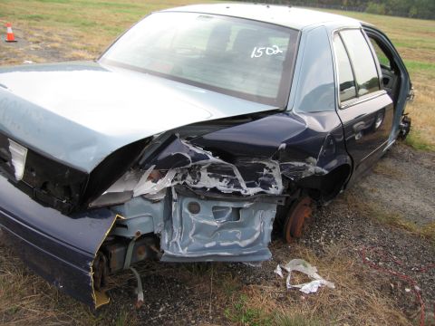 1991 Ford LTD Crown Victoria - This 1991 Ford Crown Victoria LTD has significant damage to its rear quarter panel and is missing a wheel.