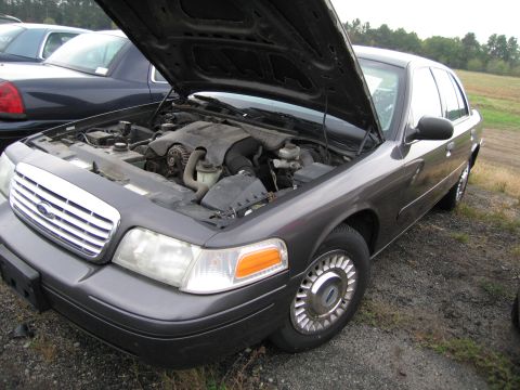 1991 Ford LTD Crown Victoria - This 1991 Ford Crown Victoria LTD is shown with its hood open, revealing the engine compartment.