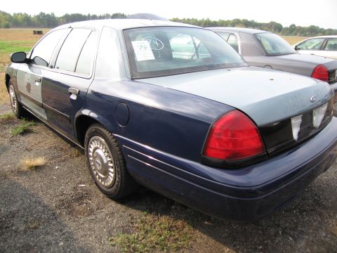 1991 Ford LTD Crown Victoria - This Ford Crown Victoria has a two-tone paint job and appears to be a former police vehicle.