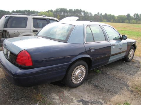 1991 Ford LTD Crown Victoria - This 1991 Ford Crown Victoria LTD sedan is seen from a 3q-front angle, with a two-tone paint scheme.